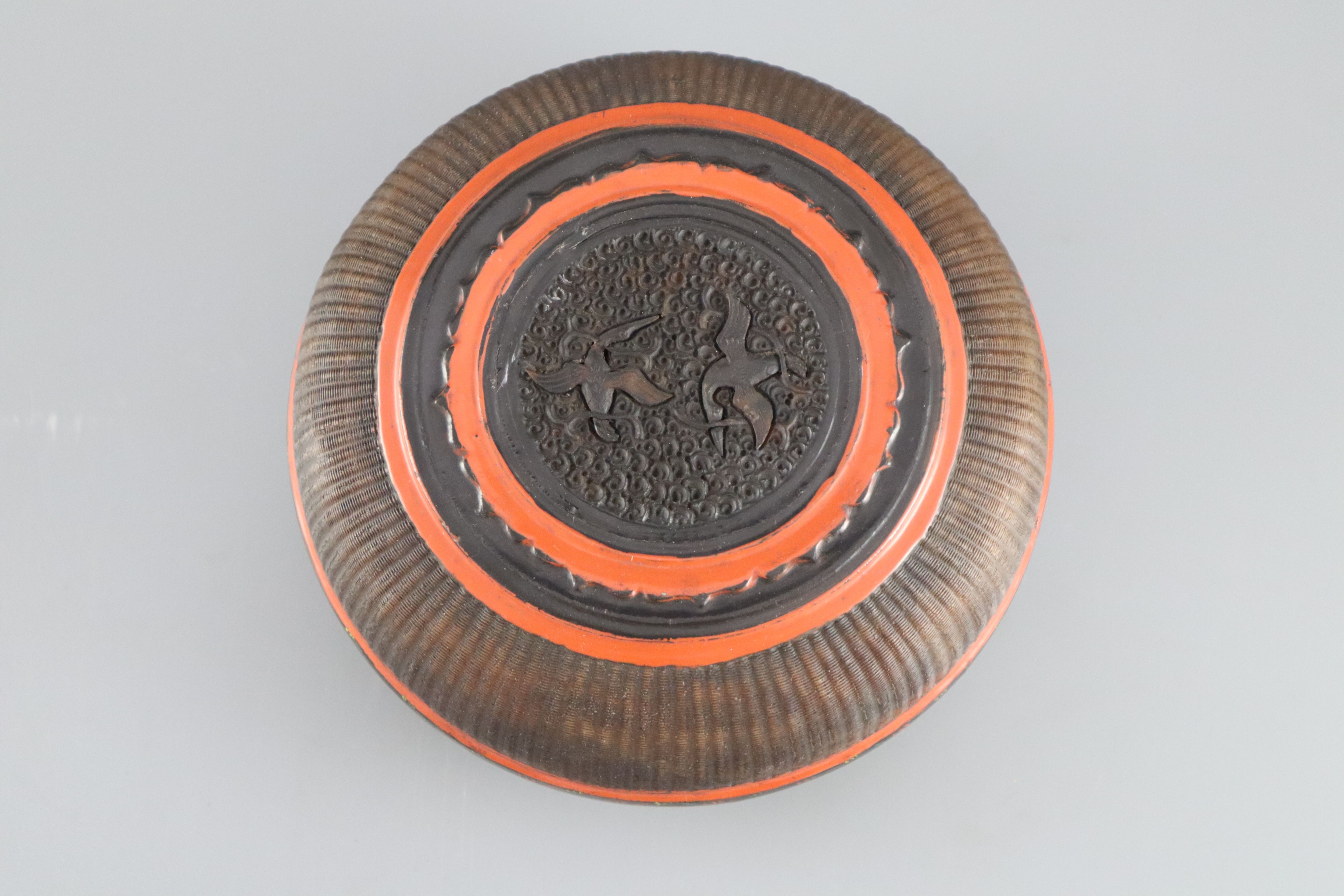 A Southern Chinese lacquer and basket weave box, 18th/19th century, with carved tortoiseshell roundel to the cover, 20.5cm diameter